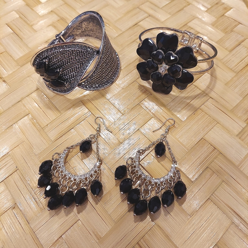 Dangle silver toned earrings and bracelet jewelry set w/black simulated stones